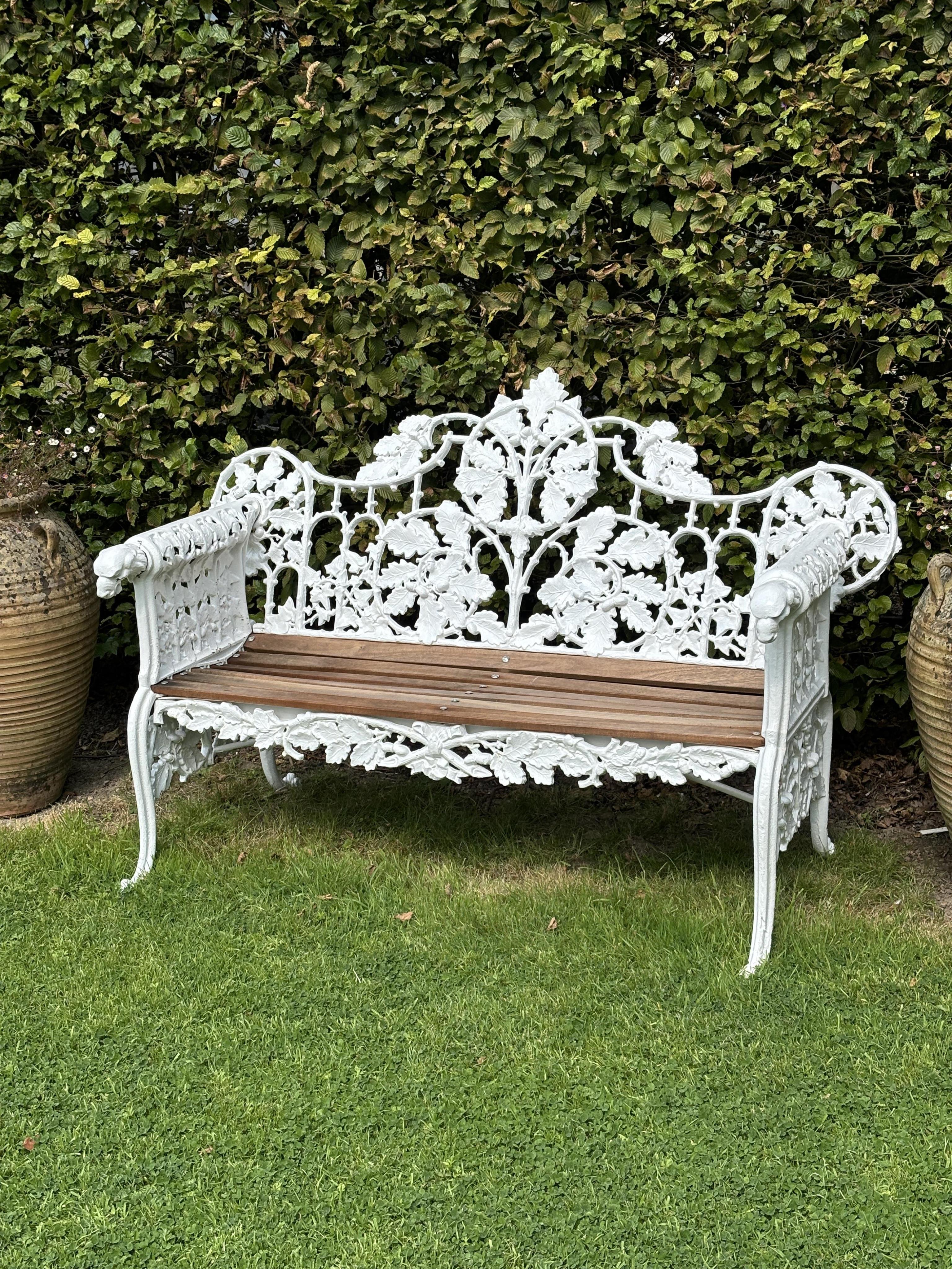 A pair of Coalbrookdale style cast iron garden benches